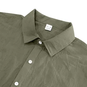 Detail view of a green men's linen shirt collar showing texture and size label.