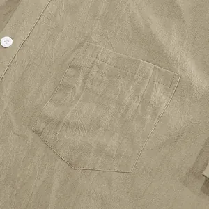 Close-up of men's linen shirt pocket with natural fabric texture and button