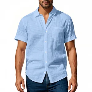 Detail view of light blue men's linen short sleeve shirt featuring a front pocket