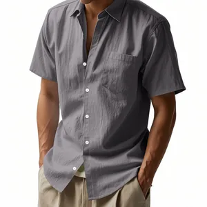 Detail view of a men's dark grey linen short sleeve shirt with chest pocket and buttons.