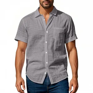 Close-up of men's grey linen short-sleeve shirt featuring textured fabric and chest pocket