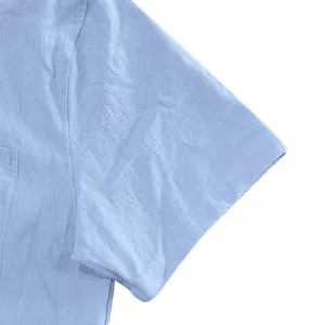 Macro detail of blue linen fabric texture on men's short sleeve casual shirt