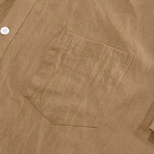 Close-up of men's linen shirt pocket showing high-quality fabric texture and stitching.