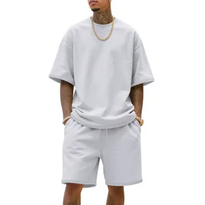 Detail view of light gray men's oversized t-shirt and matching shorts in streetwear style