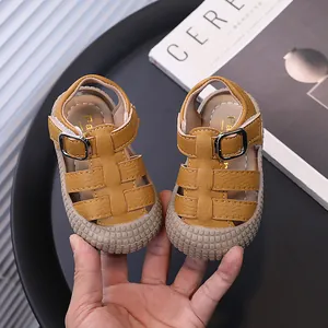 Toddler closed-toe leather sandals with soft soles and buckle straps in yellow color