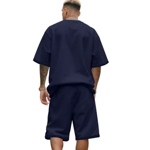 Back view of men's navy blue heavy terry short sleeve and shorts set, loose fit style.