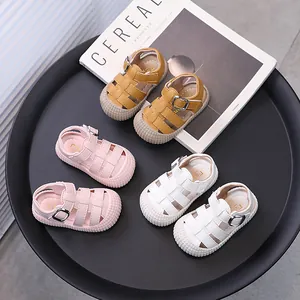 Soft-sole toddler sandals with closed-toe design available in yellow, pink, and white
