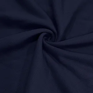 Macro detail shot showing the premium navy blue heavyweight French terry fabric texture.