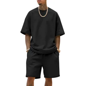 Detail view of men's oversized black heavy terry streetwear t-shirt and shorts set