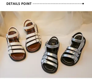 Close-up of girls' Roman sandals with multi-strap buckle design in white and silver