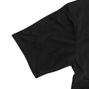 Close-up detail of the durable ribbed sleeve cuff on a heavy black cotton street t-shirt
