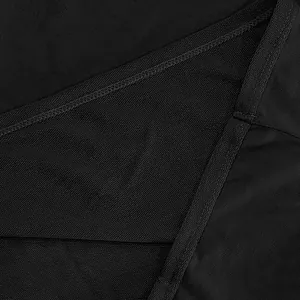 Macro detail of high-quality heavyweight black terry fabric and inner seam stitching