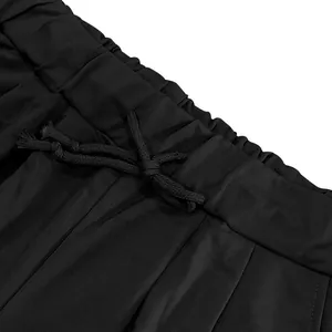 Detailed macro view of heavy cotton black sports shorts featuring a drawstring waistband