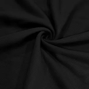 Macro view showing the detailed texture of premium heavy black terry knit fabric for men