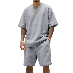 Detailed view of men's grey heavy terry cotton sports t-shirt and shorts set on model