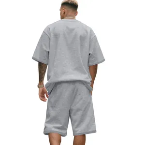 Back view of men's oversized grey heavy cotton terry t-shirt and shorts set for summer