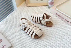 Beige children's woven Roman sandals with hollow-out design and soft rubber sole