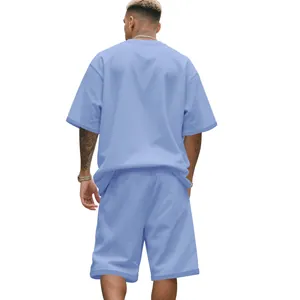 Back view of heavy cotton oversized men's summer short sleeve and shorts set in blue
