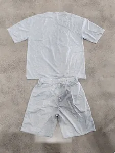 Flat lay view of grey oversized heavy terry cotton streetwear t-shirt and shorts set