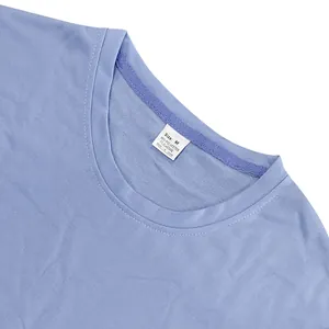 Detailed macro view of light purple heavyweight terry t-shirt neckline and size M label