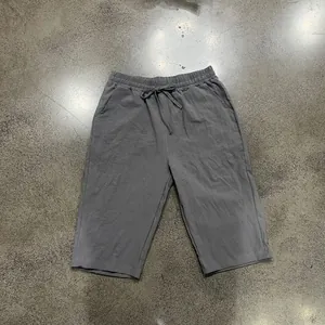 Comfortable men's casual grey linen shorts with drawstring waist and straight leg