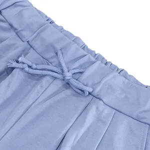 Close-up detail of the elastic waistband and drawstring on blue heavy cotton shorts