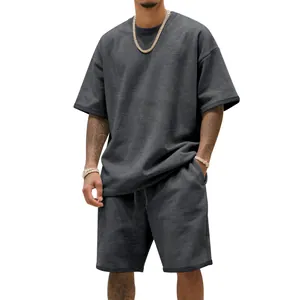 Detailed view of men's dark grey oversized heavy terry t-shirt and shorts set texture