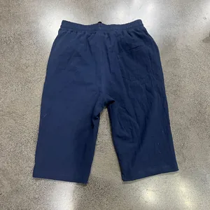Detailed back view of navy blue loose casual linen shorts with elastic waist for men