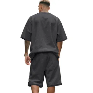 Back view of men's oversized charcoal grey terry high street summer t-shirt and shorts set