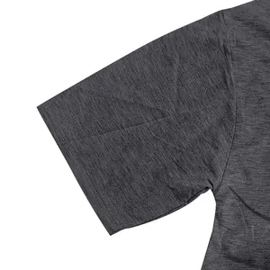 Close-up of heavy French terry fabric texture on charcoal gray t-shirt sleeve detail