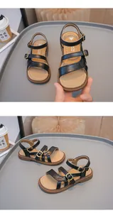 Detailed side and front view of black girls' open-toe sandals with golden buckles