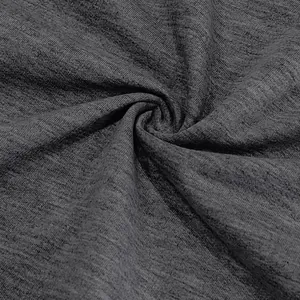 Macro close-up view showing the texture of dark heather gray heavy French terry cotton fabric.