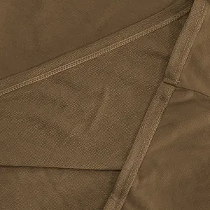 Detailed macro view showing the heavy brown French Terry fabric texture and seams