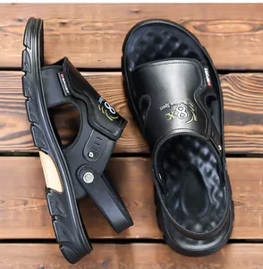 Close-up of black men's casual leather sandals with a functional dual-use backstrap design