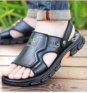 Close-up detail of men's premium black leather sandals with athletic sports design
