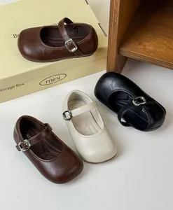 Vintage style girls' Mary Jane leather shoes in dark brown, black, and cream colors.
