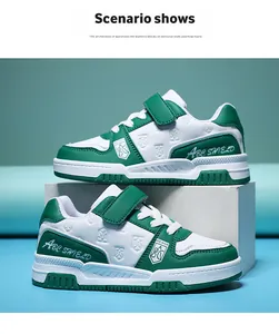 Close-up view of stylish green and white children's sneakers with Velcro straps