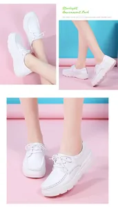 Detail view of white lace-up nurse shoes with a thick non-slip platform sole