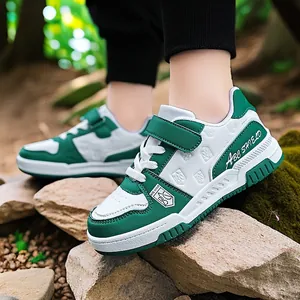 Durable green and white boys sneakers with breathable leather and velcro strap for kids