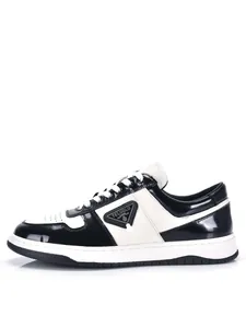 Detailed side view showing the stylish black and white leather men's low-top sneakers