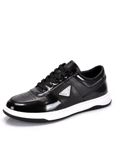 Classic black leather men's low-top sneakers with stylish triangular metal logo detail