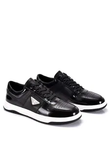 Black leather men's sneakers with triangular logo and white sole detail