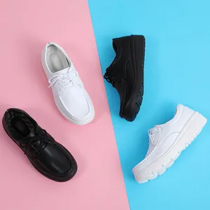 Comfortable women's nursing shoes with thick soles and lace-up design in black and white