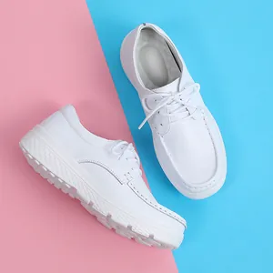 White breathable nursing shoes for women with lace-up design and thick non-slip soles
