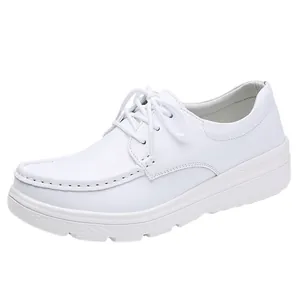Professional white lace-up nurse shoes for women featuring comfortable platform heel