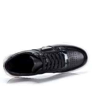 Stylish men's black leather low-top casual sneakers with white rubber soles for summer