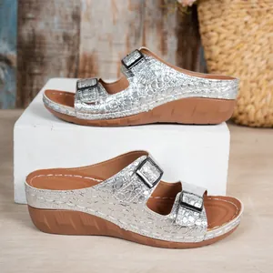 Silver crocodile embossed wedge sandals with double adjustable buckle straps.