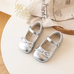 Elegant silver girls' Mary Jane shoes featuring a delicate bow knot and comfortable flat sole.