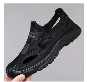 Close-up of black breathable mesh men's beach sandals with hollow-out design