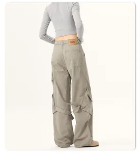 Detail view of American vintage high-street loose wide-leg cargo pants with large pockets.